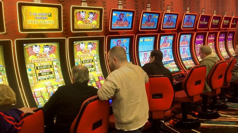 Patrons play the machines at Jake's 58 hotel