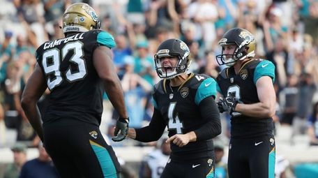 Josh Lambo of the Jaguars celebrates after he