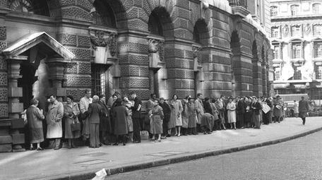 A queue forms outside The Old Bailey Central