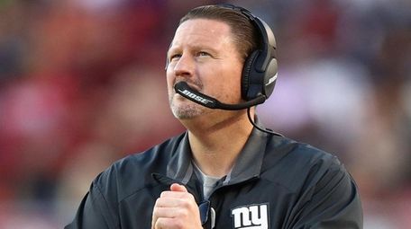 Giants head coach Ben McAdoo looks on against the 49ers at