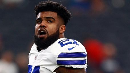 Ezekiel Elliott of the Cowboys stands on the