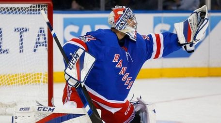 Ondrej Pavelec of the Rangers makes a save against