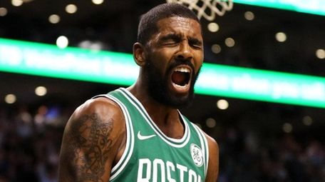 Celtics guard Kyrie Irving celebrates during a game