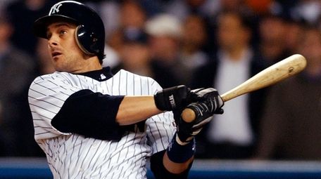 Then-Yankees third baseman Aaron Boone watches his game-winning