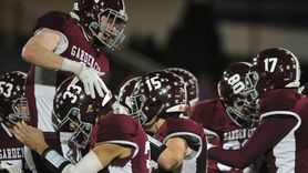 Garden City teammates celebrate after their 33-0 win