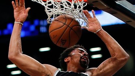 Nets guard Spencer Dinwiddie dunks the ball against