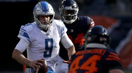 Matthew Stafford of the Detroit Lions carries the