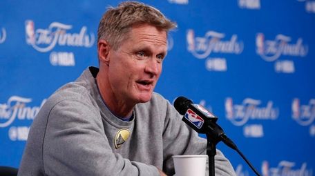 Warriors head coach Steve Kerr talks to the