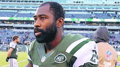 Jets cornerback Darrelle Revis walks on the field