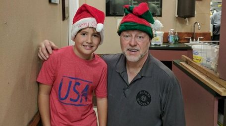 Kidsday reporter Jacob Lien with Gerard Donohue, owner