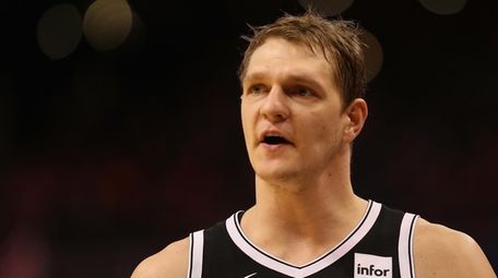 Timofey Mozgov #20 of the Brooklyn Nets reacts