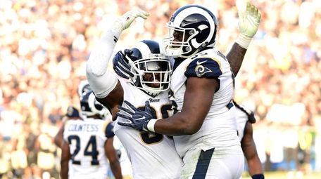 Michael Brockers and Tyrunn Walker of the Rams