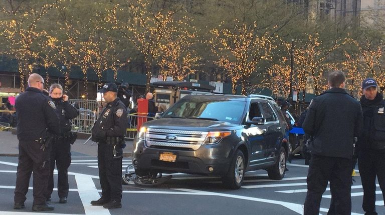 Police investigate after a sedan collided with an