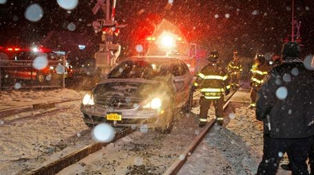 Members of the Bayport Fire Department work to