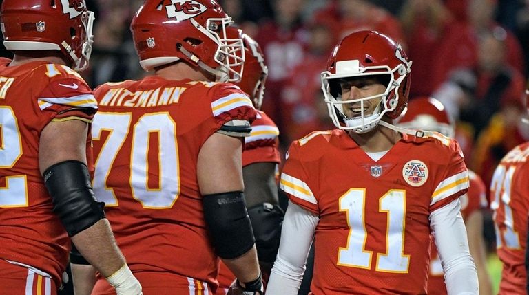 Chiefs quarterback Alex Smith smiles during a game