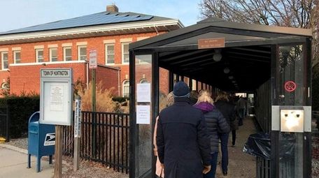 A line of residents waiting to pay their