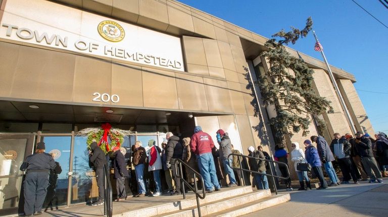 People wait at the Town of Hempstead tax