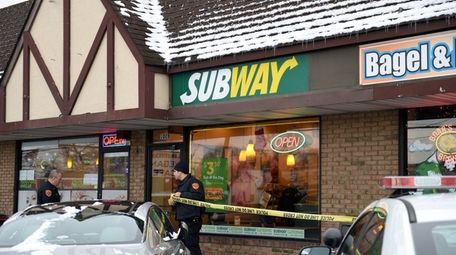 Suffolk County police at scene of a robbery