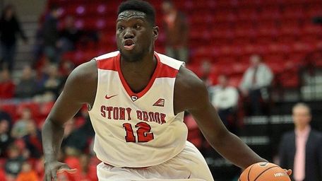Stony Brook forward Tyrell Sturdivant drives into the