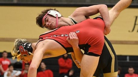 Wantagh's Justin Vines wrestles Plainedge's Mike Ciuffo in