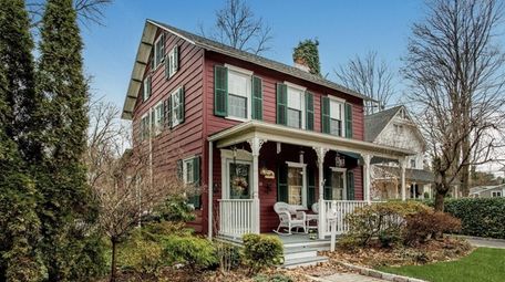 Outdoor shutters and a fireplace mantel in a