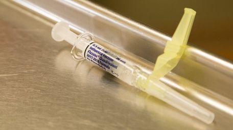 An influenza vaccine syringe at Syosset Hospital on