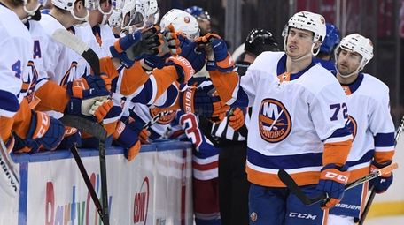 Islanders center Anthony Beauvillier is congratulated by teammates