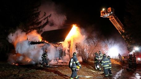 Firefighters on the scene of a fire at