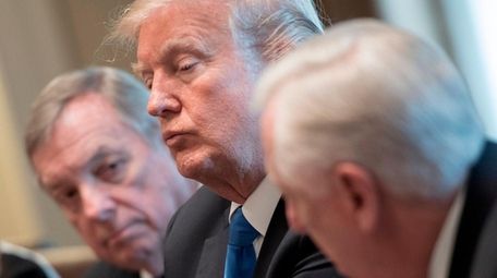 President Donald Trump, with Sen. Dick Durbin, left,