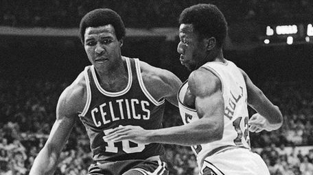 Jo Jo White, left, of Boston Celtics, drives
