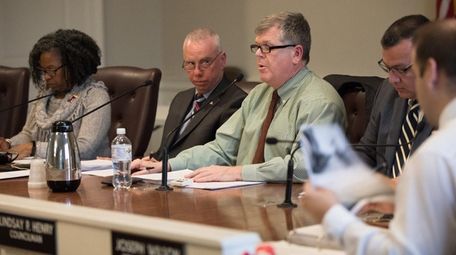 Babylon Supervisor Rich Schaffer, center, and the town