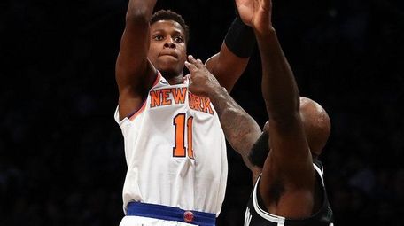 Frank Ntilikina of the Knicks shoots against Quincy