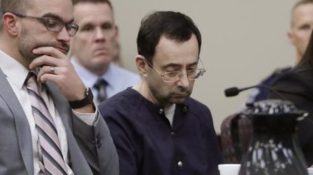 Larry Nassar sits with attorney Matt Newburg during