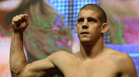 Joe Lauzon poses on the scale during his