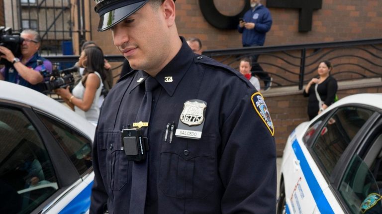 An NYPD officer with the 34th Precinct in