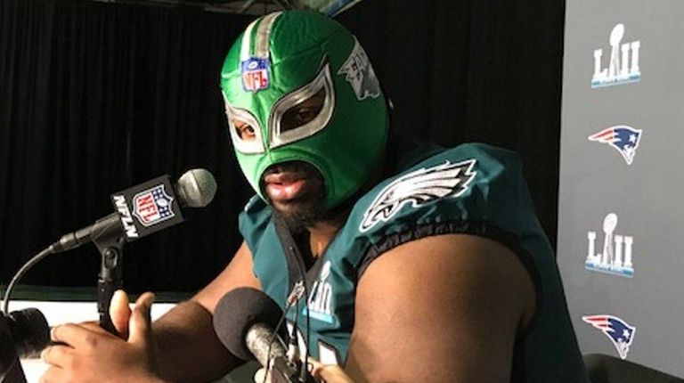 Fletcher Cox wears a wrestling mask during media