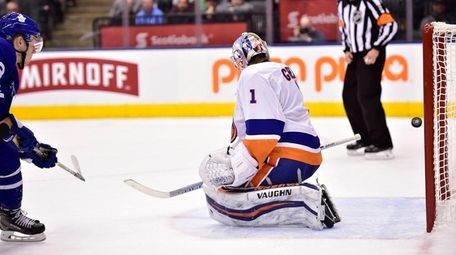 Maple Leafs defenseman Travis Dermott scores past Islanders