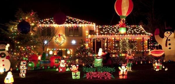 Holiday decorations light up the front yard of