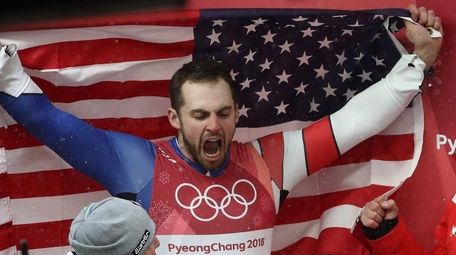 Chris Mazdzer of the United States holds the