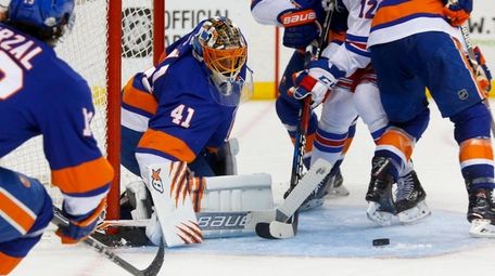 Jaroslav Halak of the Islanders makes a save