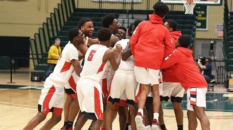 Amityville players celebrate their 83-66 win against Westhampton