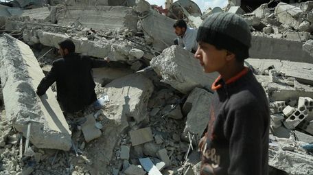 Syrian civilians search for survivors in the eastern