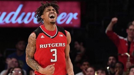 Rutgers guard Corey Sanders reacts after sinking a