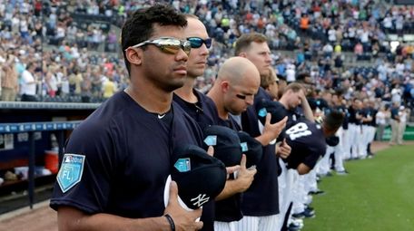 Seattle Seahawks quarterback Russell Wilson stands with the