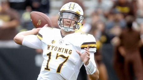 Josh Allen of the Wyoming Cowboys warms up