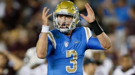 UCLA quarterback Josh Rosen gestures as if he