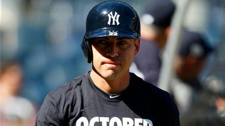 Jacoby Ellsbury of the Yankees looks on during workout