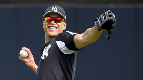 Yankees' Giancarlo Stanton works out on the field