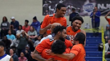 Nassau players celebrate after defeating Suffolk in the