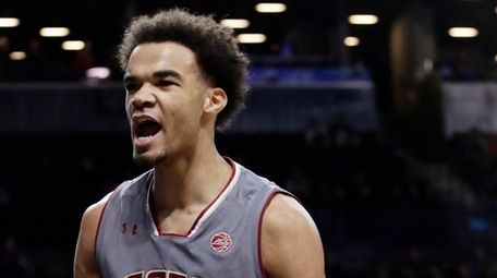 Boston College's Jerome Robinson reacts after scoring during
